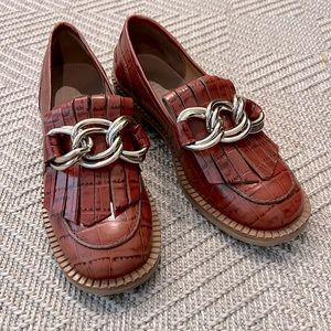 Medallion leather fringe loafers